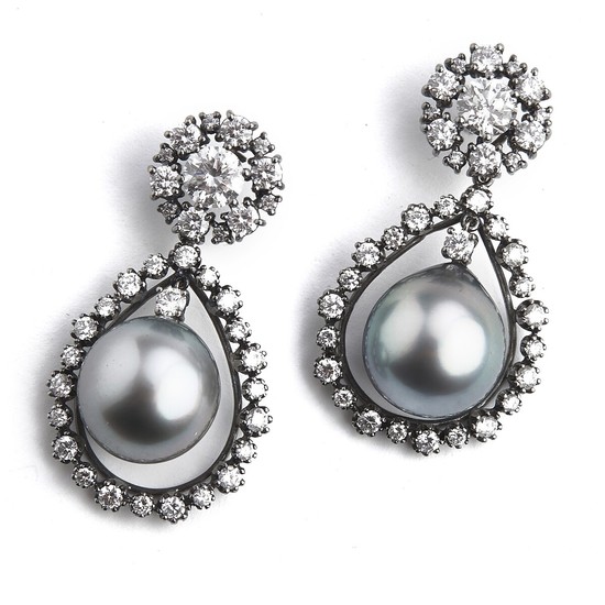Hartmann's: A pair of Tahiti pearl and diamond ear pendants each set with a Tahiti pearl and diamonds, totalling app. 4.32 ct., mounted in 18k white gold. (2)