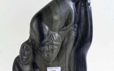 Large Canadian Eskimo Art carved soapstone figure group, 38cm tall, bearing label to the base