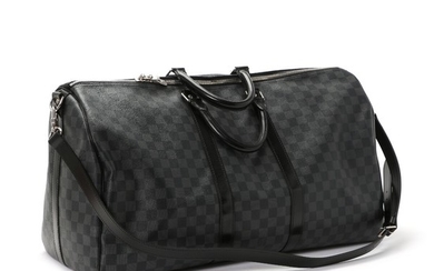 Louis Vuitton: A “Keepall Bandouliere” bag made of grey and black Damier Graphite canvas, black leather details, two short handles and a long strap.
