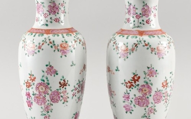 PAIR OF FINELY ENAMELED CHINESE FAMILLE ROSE PORCELAIN VASES In baluster form, with decoration of floral swags and sprays. Heights 1...