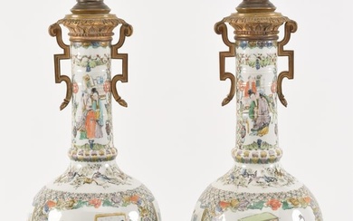 Pair of 19th century Chinese famille verte porcelain vases with heavy bronze mounts. Figures in