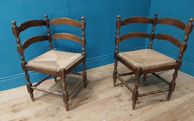 Pair of early 20th C. walnut corner chairs with rush seats {...