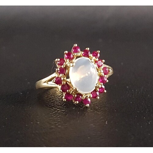 RUBY AND MOONSTONE CLUSTER RING the central oval cabochon mo...