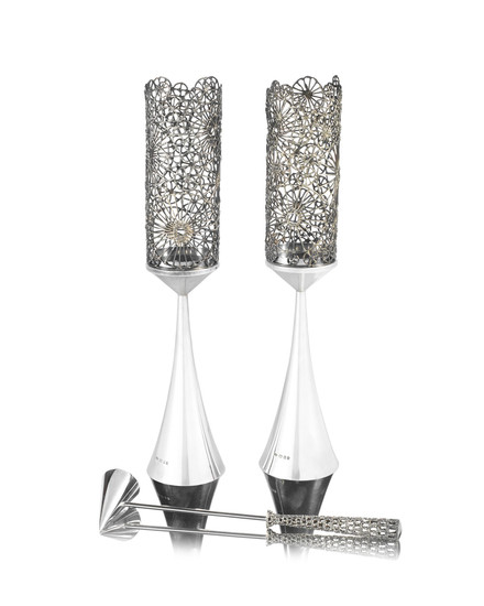 STUART DEVLIN: A pair of silver and silver-gilt filigree candlesticks