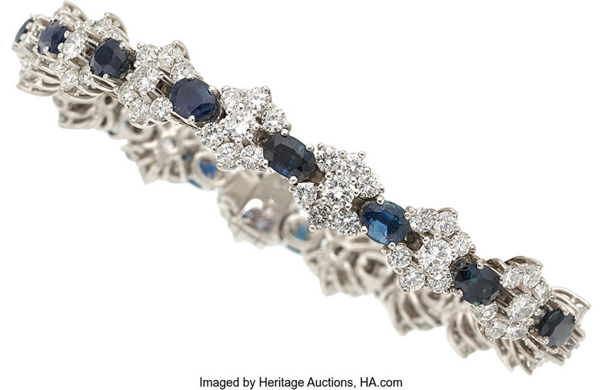 Sapphire, Diamond, White Gold Bracelet The bracelet features oval-shaped...