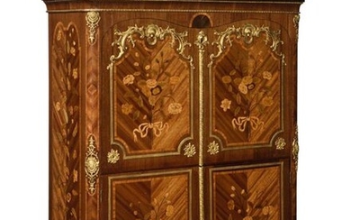 Secretary with flap in flower marquetry, satin and amaranth, opening with two leaves and a flap revealing seven drawers, six compartments and a secret compartment with a sliding shelf, the front with gilded bronze frames, the top in yellow Sienna...