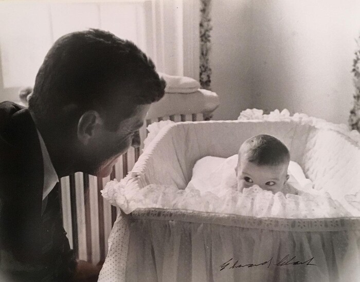Senator John Kennedy with his baby daughter Caroline
