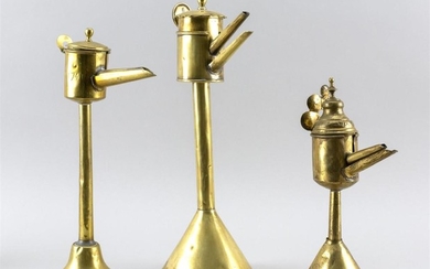 THREE FLEMISH BRASS SPOUT LAMPS Heights from 11" to 14".