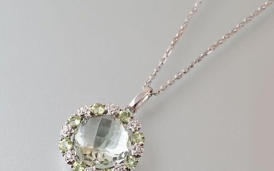 The pendant and its chain with chainmail forçcat, the pendant of round shape is decorated in its center with a prasiolite calibrating approximately 7,45 carats of faceted round cut, hemmed of eight round peridots intercalated with eight diamonds.