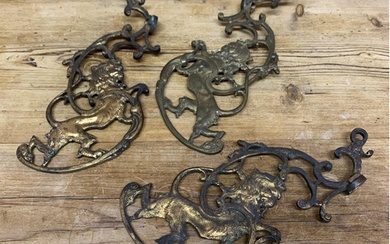 Three good quality antique gilt cast iron scrolled lion brac...