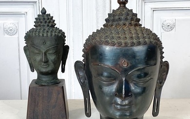 Two Antique Bronze Buddha Heads