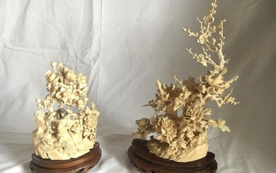 Two groups in ivory, one representing trees in...
