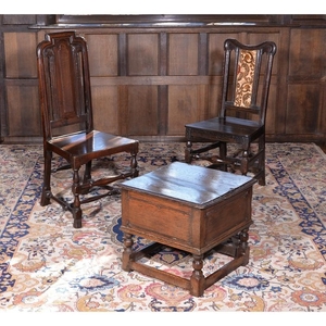 Two similar William III oak hall chairs, circa 1700