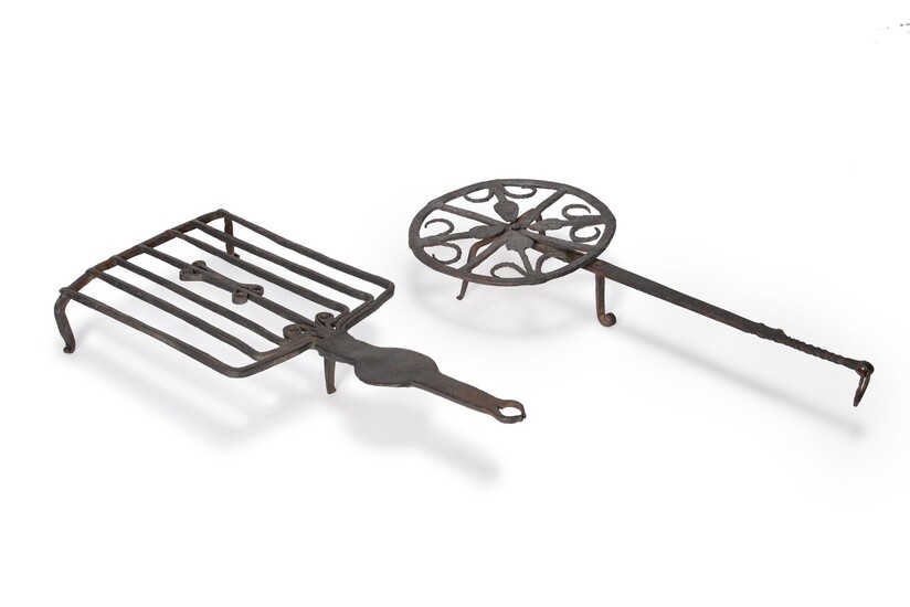 Two wrought iron trivet stands