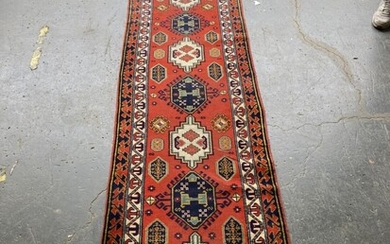 Vintage Caucasian Wool Runner, with alternating blue & white medallions on a red field (330 x 75cm)