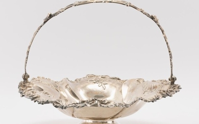 WILLIAM IV STERLING SILVER CAKE BASKET Charles Reily & George Storer, maker. Rim cast with flowers and rocaille. Pierced handle. Sca...