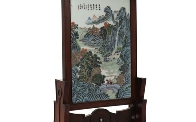 A Chinese table wooden screen with porcelain plaque decorated with mountainous scenery. Late Qing - Republic. H. 67 cm. W. 38 cm. Plaque 44×29 cm.