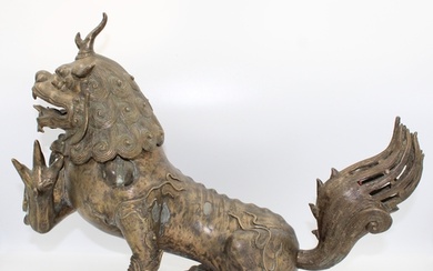 18th-century Chinese bronze Buddhist lion featuring intricat...