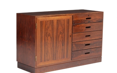 Kaj Winding: A rosewood sideboard, front with five drawers and door. Manufactured by Silga Møbler. H. 68. W. 110. D. 40 cm.
