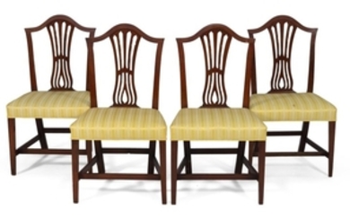 SET OF FOUR HEPPLEWHITE SIDE CHAIRS In cherry. Backs with arched crest rails and vertical pierced splats. Seats with yellow striped...