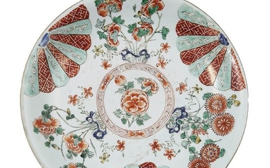 60-China: a round dish decorated with flowers painted...