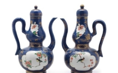 A PAIR OF BLUE-GROUND FAMILLE VERTE DOUBLE-GOURD EWERS AND COVERS, KANGXI PERIOD (1662-1722)