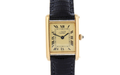 CARTIER - a yellow metal Must de Cartier Tank wrist watch.