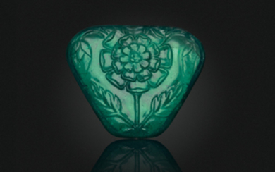 A CARVED EMERALD