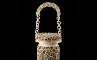 A carved and pierced ivory basket with handle decorated with floral and geometric motifs China, 19th century (h. 40 cm.)