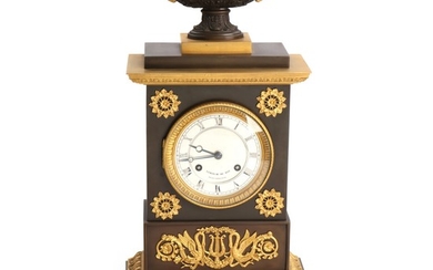 A Charles X partly patinated bronze mantle clock by Leroy. C. 1830. H. 45 cm.