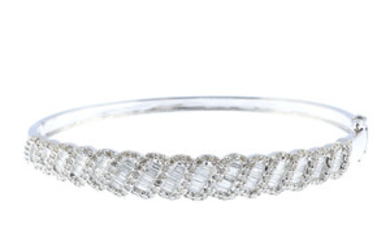A diamond hinged bangle. View more details