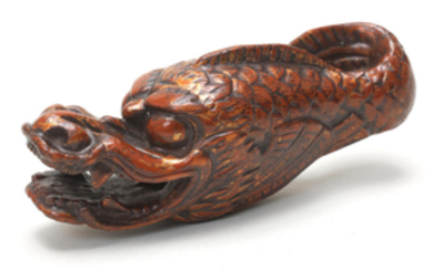 A lacquered-wood netsuke of a hiryu (flying dragon)