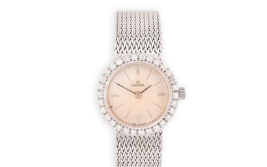 A LADY'S 18K GOLD AND DIAMOND SET COCKTAIL WATCH, …