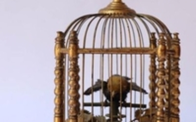 Petit automate représentant un oiseau en cage doré…