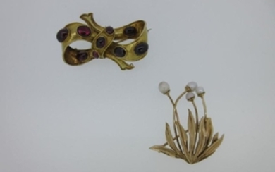 A Victorian cabochon garnet bow brooch together with a
