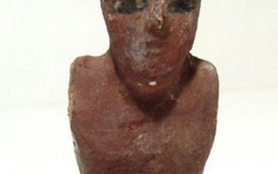 An Egyptian seated wood painted figure of a man