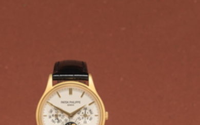 Patek Philippe. A fine 18K gold automatic triple calendar wristwatch with moon phase