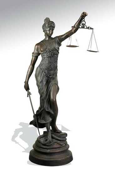 Bronze sculpture of Lady Justice holding her scales