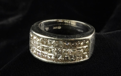 A 14 Carat White Gold and Diamond Half Hoop Style Ring. The front set with 30 princess cut diamonds