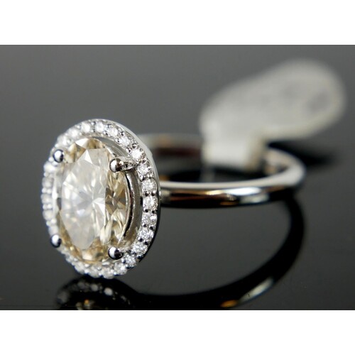 A 14CT WHITE GOLD, CHAMPAGNE DIAMOND AND DIAMOND RING A cent...