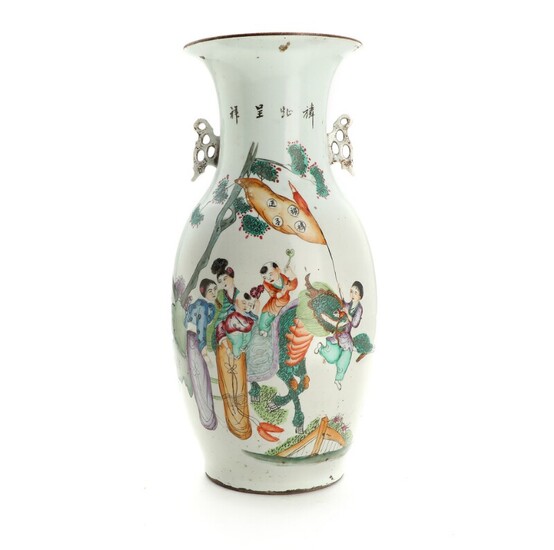 A 19th-20th century Chinese porcelain vase, decorated in colours with qilin surrounded by women and children. H. 42.5 cm.