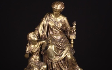 A 19th Century Gold Patinated Bronze Figure Group cast with a seated Classical female and a young gi
