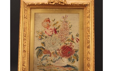 A 19th century woolwork panel, worked in colourful wools wit...