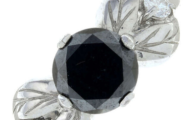 A 9ct gold diamond and black gem ring.