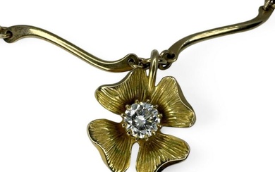 A 9ct gold estimated 0.85 carat diamond set flower pendant...