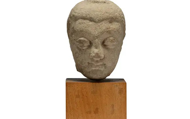 A Burmese carved limestone head of Buddha 17th/18th century Carved with serene...