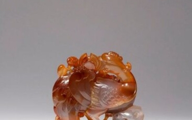 A CHINESE AGATE 'PHOENIX AND PEONY' CARVING 18TH CENTURY The...