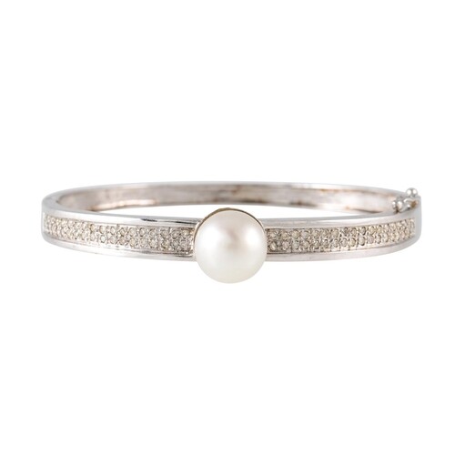 A CULTURED PEARL AND DIAMOND BANGLE, hinged form, mounted in...