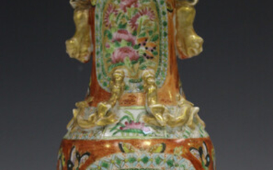 A Chinese Canton famille rose porcelain vase, mid-19th century, painted with gilt ground panels of b