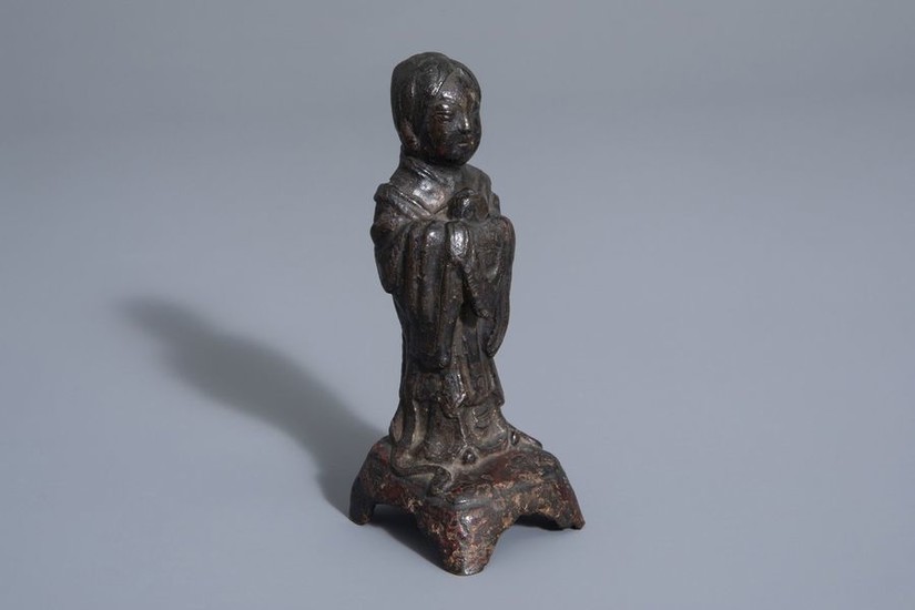 A Chinese bronze figure of a standing lady,...